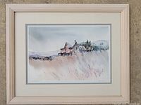 Framed watercolor artwork showing a house and landscape, framed with double mat