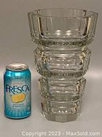 Front view of the faceted clear crystal vase next to a Fresca soda can for size reference, showing its heavy and thick octagonal form with four distinct tiers.