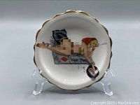 Photo of the front of the Glamour Girls pinup dish featuring the pinup girl with gambling theme and gold trim