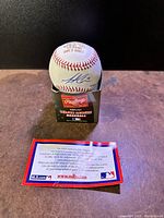 Signed official Rawlings Major League Baseball on cardboard stand with Certificate of Authenticity.