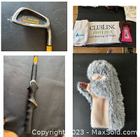 Golf swing trainer head with 'M Swing Trainer' text and ergonomic yellow and black handle grip