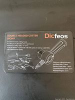 Metal cutter case lid with product specifications and instructions for Dicfeos DIC001 double-headed cutter.