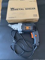 Front view of Wen electric metal shear with its original cardboard box showing model 3650 and 18 gauge variable speed.