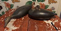Both decoys side by side on marble surface