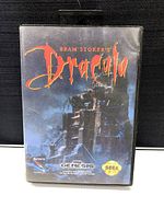 Front view of Bram Stoker's Dracula Sega Genesis game case showing title and artwork of dark castle.
