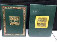 Book and slipcase placed side by side, showing overall presentation and matching design of the lot.