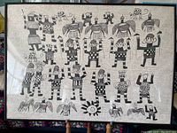 Full view of the framed lithograph artwork showing various abstract humanoid figures arranged in rows with winged shapes and geometric patterns.