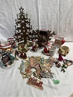 Wide shot of all Christmas decor items and candleholders showing variety and quantity
