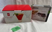 Box containing 4 stemless martini glasses by President's Choice and box of Moda Concept glass hors d'oeuvre dishes.