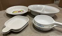 Set of all dishes from above showing Corningware and Portuguese stoneware dishes