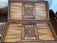 Open large backgammon board showing intricate inlay pattern and playing surface