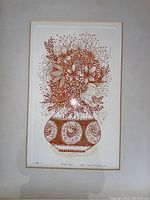 Close-up of floral print with signature, edition number 52/200 noted below the image, framed with matting and glass