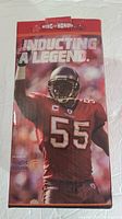 Photo of the inducting a legend box with Derrick Brooks image and Buccaneers logo