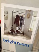 Photo of boxed Brightroom metal garment rack showing product image and brand name.