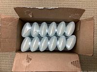 Box containing twelve sealed Degree Dry Protection deodorant sticks arranged in two rows, white caps visible.