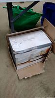 Original box containing Threshold Woodbridge 16-piece dinnerware set showing box condition and packaging