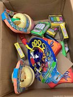 Box containing new Zulu Max Bubble Whizzer bubble wands and packs of street chalk