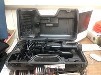 Open HC-30 system case with Canovision 8 video camera packed inside along with cables.
