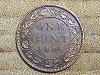 Reverse side of the 1896 Canadian One Cent coin showing denomination and date surrounded by maple leaves.