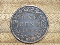 Reverse of the 1899 Canadian one cent coin showing 'ONE CENT 1899' surrounded by maple leaf wreath