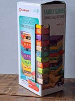 Boxed set of TopBright Family Games Animal Stacking Game showing colorful painted wooden animal blocks stacked on the box image and branding details.
