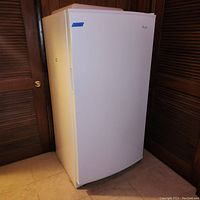 Front view of closed white freezer