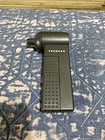 Front view of the TECHVAC handheld vacuum showing its textured grip and the TECHVAC branding.