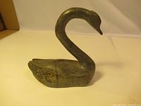 Front and side view of soapstone snow goose carving showing curved neck and stylized body