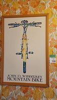 Front view of framed John D. Wibberley mountain bike artwork poster showing the whole image and text.