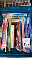 Top view of the lot showing the titles of multiple Christmas books including 'Sing With Me', 'A Christmas Alphabet', 'Christmas in My Mind', and 'House of Christmas Miracles'.