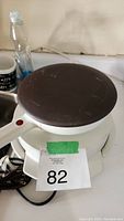 Top view of Braun waffle and crepe maker showing brown circular cooking surface with visible scratches and wear.
