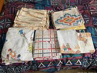 Photo showing five folded bedding items with distinct prints including cartoon characters, geometric lines, southwestern pattern, wheat, and cowboy scenes.