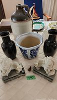 Overview of entire lot showing vases, pot, jug, and figurines