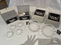 Two unopened boxes of Large Libbey Crystal Ambassador Bowls alongside eight smaller bowls outside opened boxes.