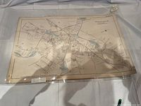 Front view of the 1888 map showing Walpole, Massachusetts with clear details of streets, waterways, and towns. Map is inside plastic protective sleeve with some edge wear and discoloration.