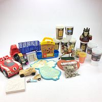 Overview of the vintage toys, Star Wars cups, music toy, and small collectibles in the lot