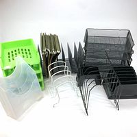 Overall lot showing desk trays, hanging file folders, plastic and mesh organizers on white background