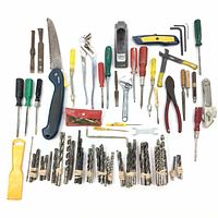 Wide shot of entire handyman tool lot showing various hand tools and bundled drill bits.