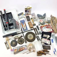 Overview of all handyman tools and painting supplies in the lot, including paint trays, rollers, wire wheels, hand tools, levels, and more.