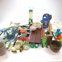 Full view of assorted home decor and garden items on white background showing all items in the lot.