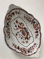 Top view showing the oval shape and floral design on the serving dish.