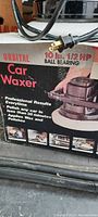 Photo showing original box of Wen Orbital Car Waxer with product info including 10 lb weight and 1/2 HP ball bearing motor.