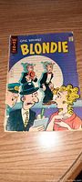 Photo of Blondie comic book featuring illustrated cover with Blondie and Dagwood characters in front, with a low cover price and noticeable wear along the edges.