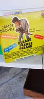 Front of the James Brown 'Please Please Please' LP sleeve with image of James Brown, album title and song listings indicated on front cover.