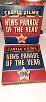 Photo showing two original Castle Films boxes for the News Parade of the Year series, 1945 and 1946.