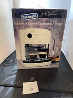 Photo of original cream-colored Delonghi Caffe Rialto espresso and cappuccino maker box with product image.