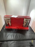 Original boxed set showing two holiday-themed Starbucks mugs and red packaging.