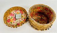 Open basket showing hand-woven ash split with floral fabric lining inside and sewn edge.