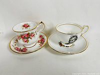 Paragon Elizabeth Rose teacup and saucer set alongside Royal Stafford Robert Burns teacup and saucer