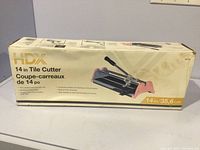 Front side of the original box showing the brand HDX and product details including the 14-inch cutting length.